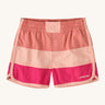 Patagonia kids swim shorts in pink colour block on a cream background