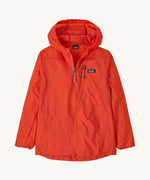 Patagonia orange houdini zip up hooded jacket on a cream background