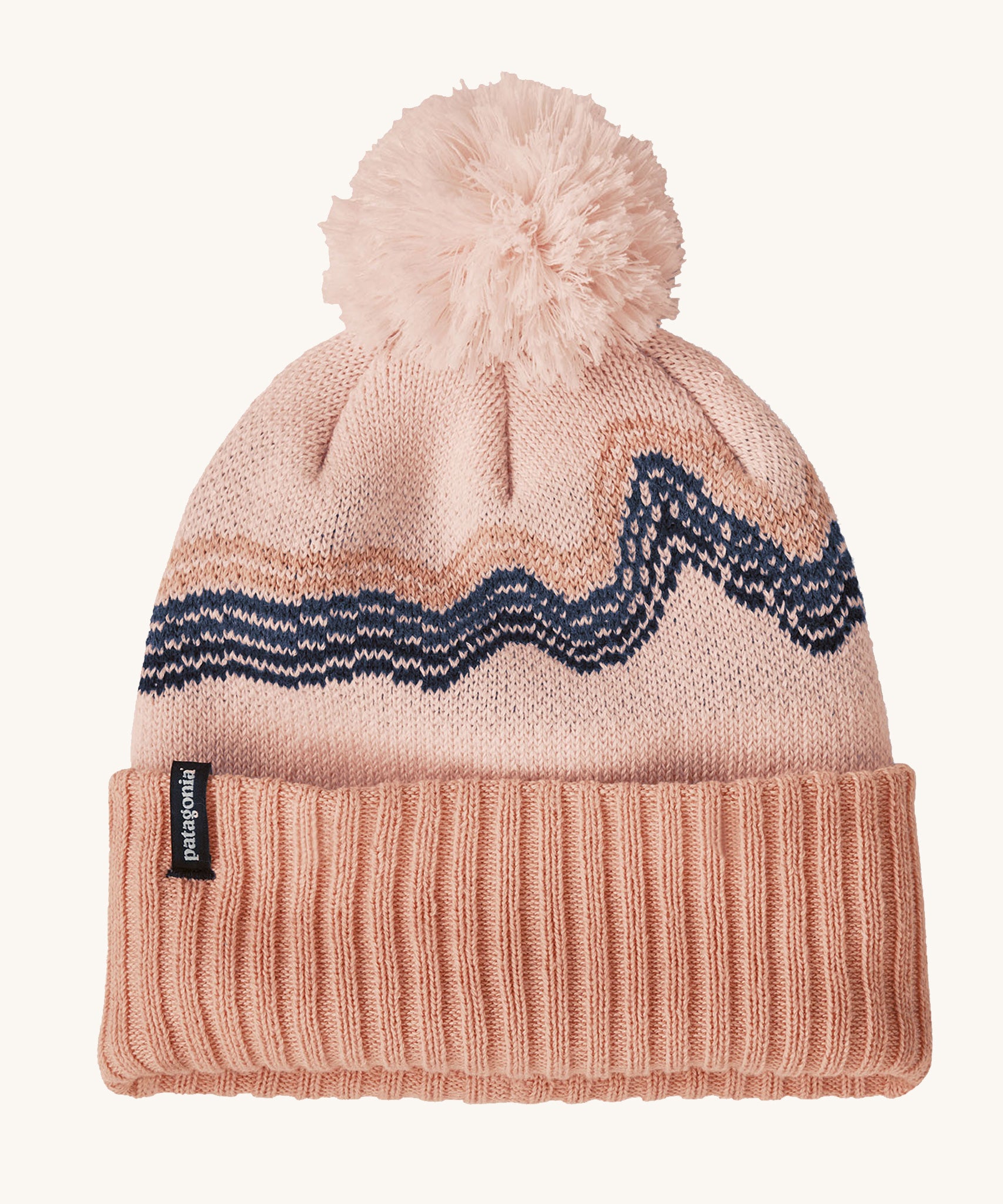 Patagonia Kids  Powder Town Beanie in a Mallow Pink colour on a plain background.