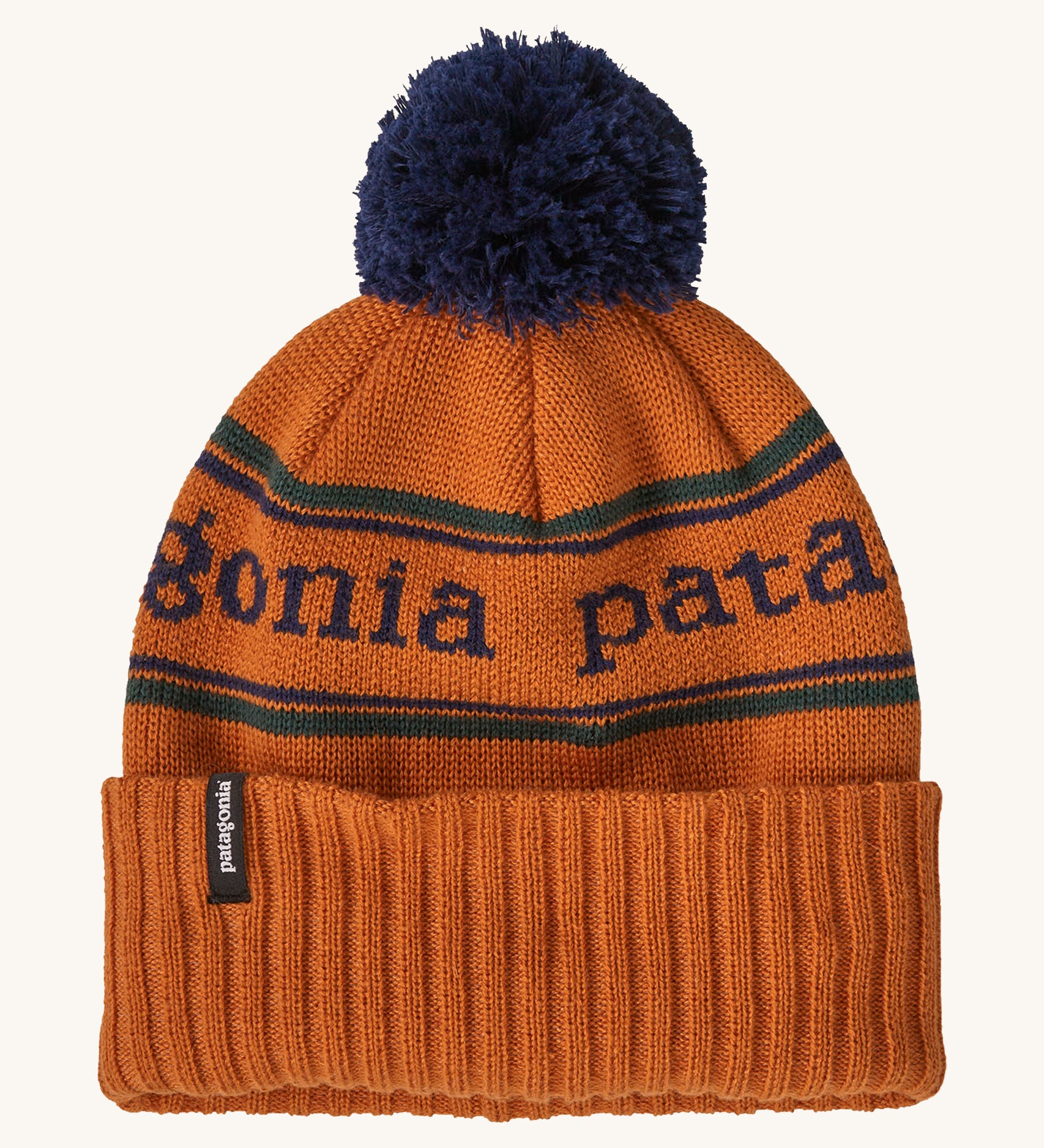 Patagonia Kids  Powder Town Beanie in an orange Redtail Rust colour on a plain background.