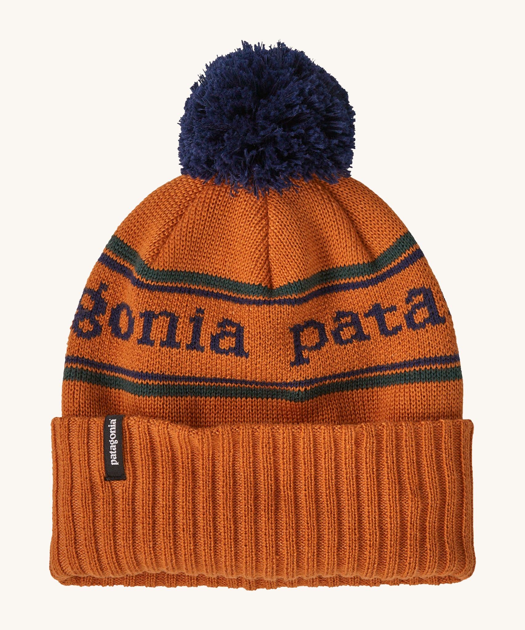 Patagonia Kids  Powder Town Beanie in an orange Redtail Rust colour on a plain background.
