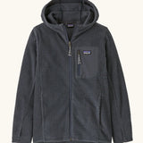 Patagonia high performance kids R1 air hoody in navy blue. Shows full length zip, thumb hole, side and chest pockets