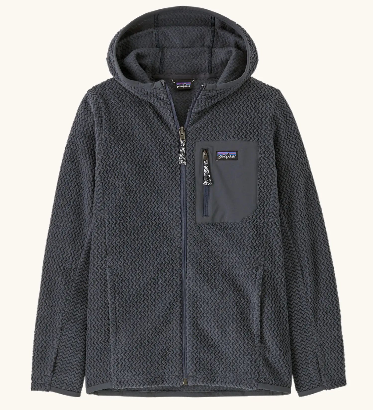 Patagonia high performance kids R1 air hoody in navy blue. Shows full length zip, thumb hole, side and chest pockets