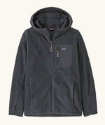 Patagonia high performance kids R1 air hoody in navy blue. Shows full length zip, thumb hole, side and chest pockets