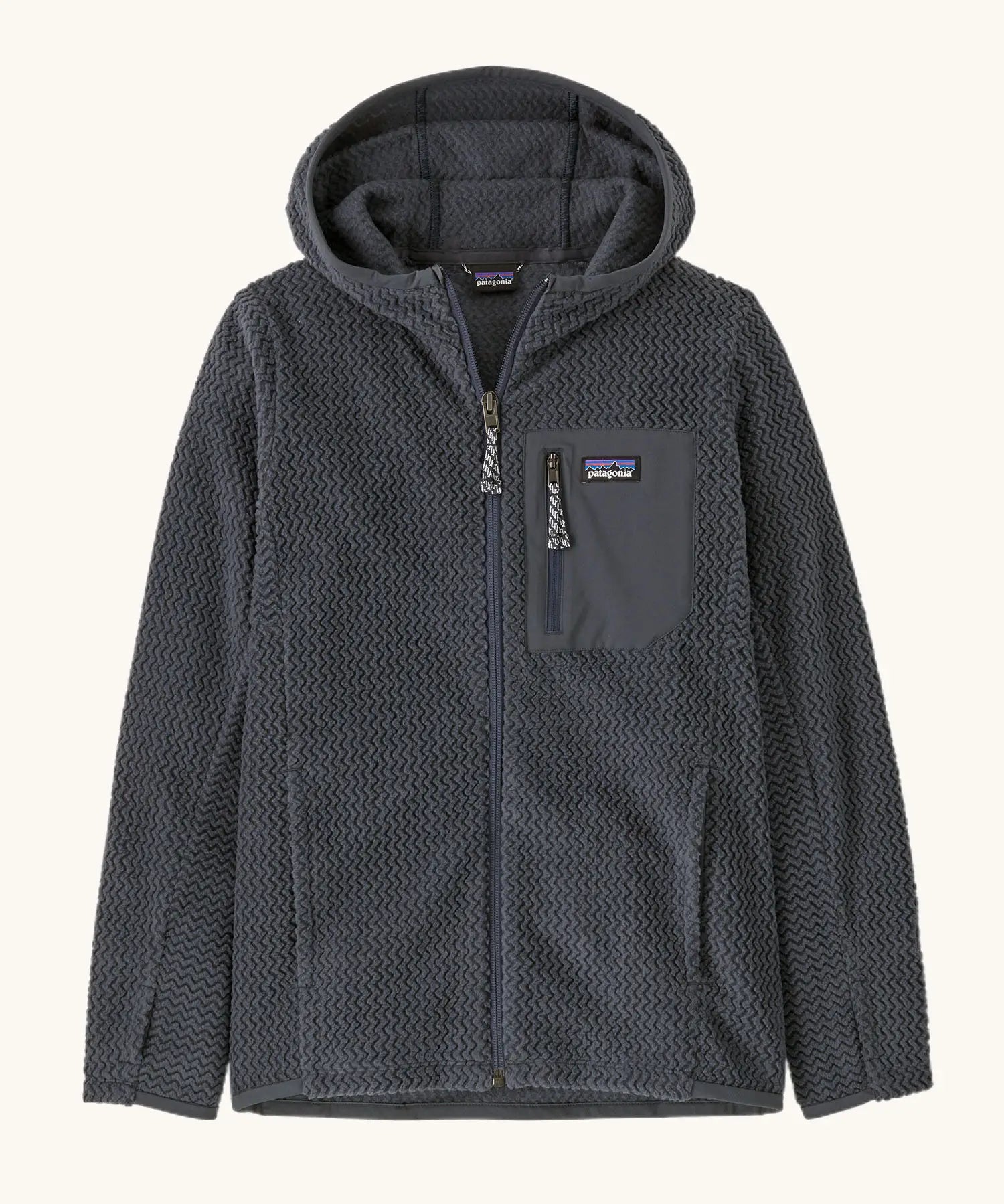 Patagonia high performance kids R1 air hoody in navy blue. Shows full length zip, thumb hole, side and chest pockets