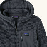 Patagonia high performance kids R1 air hoody in navy blue. Showing the elasticated trim around the hood and zip details