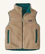 Patagonia kids ready freddy vest in cascade green showing the thick fleece. This side also features 2 side pockets. 
