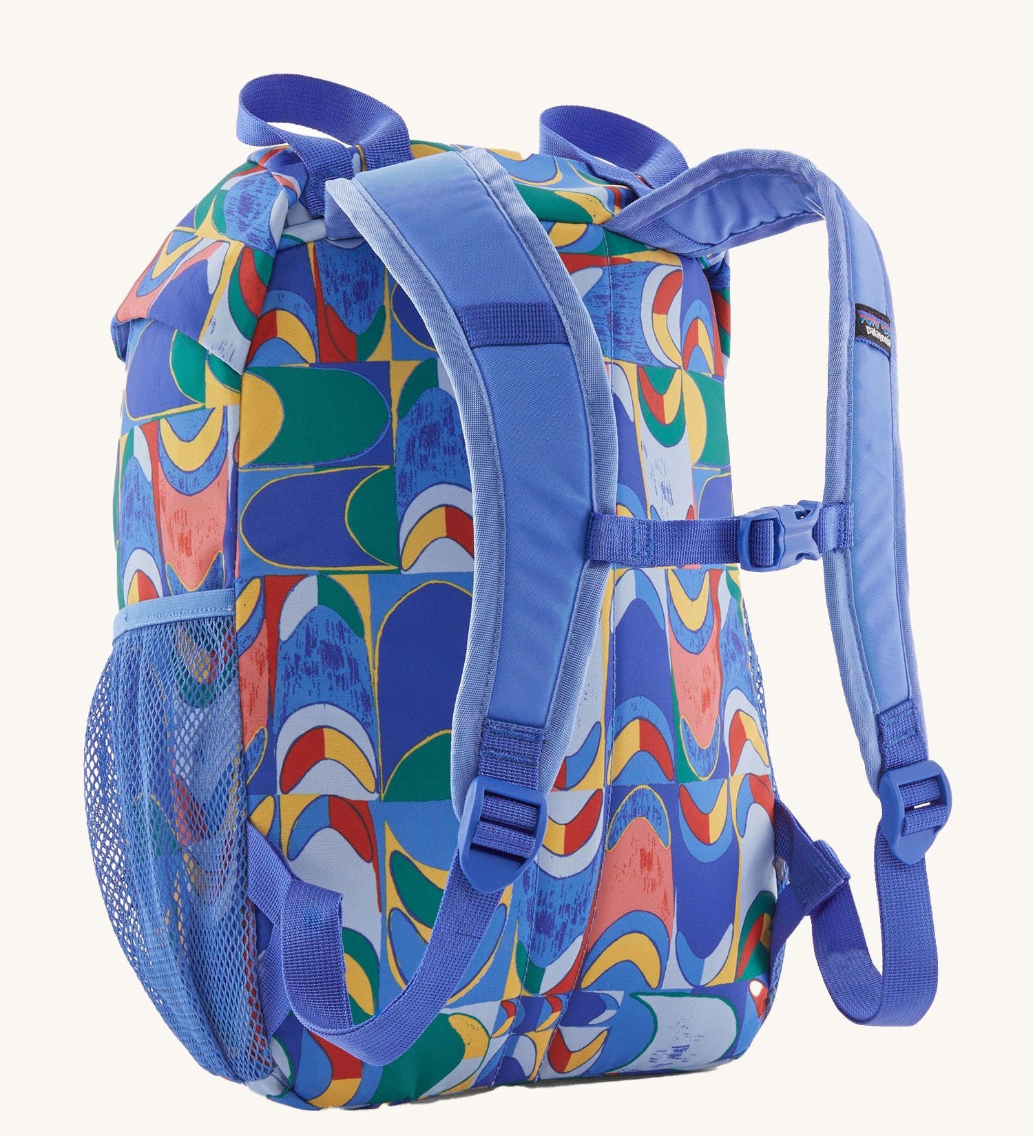 The back of a Patagonia Kids Refugito 12L Backpack with a Swallowtail Geo / Eddy Blue design on a plain background. 