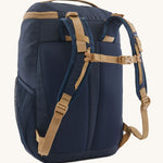 The back of the Patagonia Kids Refugito Day Pack Backpack 18L in a New Navy colour on a plain background. 