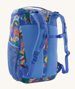 The back of the Patagonia Kids Refugito Day Pack 18L in a Swallowtail Geo / Eddy Blue design on a plain background. 