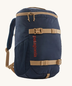 The Patagonia Kids Refugito Day Pack Backpack 18L in a New Navy colour on a plain background. 