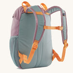 The back of a Patagonia Kids Refugito 12L in a Thermal Blue colour on a plain background. 