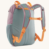 The back of a Patagonia Kids Refugito 12L in a Thermal Blue colour on a plain background. 