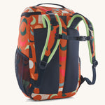 The back of a Patagonia Kids Refugito Day Pack 18L in a Mirage design on a plain background. 