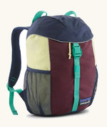 Patagonia 12 litre kids refugito day pack backpack in berry fig. Covered drawsting main compartment with  mesh pocket bottle holders on the sides.