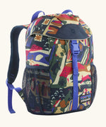 Patagonia 12 litre kids refugito day pack backpack in new navy with a let's chat pattern. Covered drawstring main compartment with  mesh pocket bottle holders on the sides.