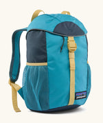 Patagonia 12 litre kids refugito day pack backpack in mako blue. Covered drawsting main compartment with  mesh pocket bottle holders on the sides.