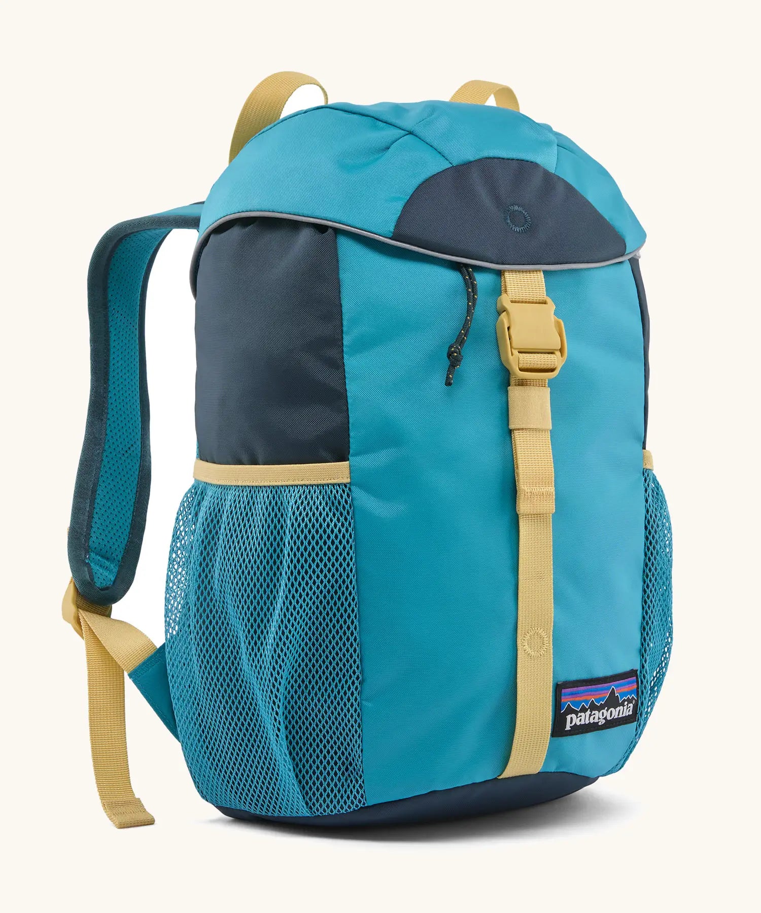 Patagonia 12 litre kids refugito day pack backpack in mako blue. Covered drawsting main compartment with  mesh pocket bottle holders on the sides.