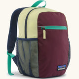 Patagonia kids 15 litre refugito day pack backpack in berry fig. Large zipped compartment with front zipped pocket and mesh side panel bottle holders.