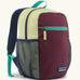 Patagonia kids 15 litre refugito day pack backpack in berry fig. Large zipped compartment with front zipped pocket and mesh side panel bottle holders.