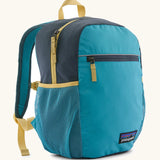 Patagonia kids 15 litre refugito day pack backpack in mako blue. Large zipped compartment with front zipped pocket and mesh side panel bottle holders.