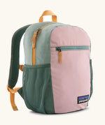 Patagonia 15 litre kids refugito day pack backpack in fuzzy mauve pink. Zipped main compartment with zipped front pocket and two mesh side pocket bottle holders on the sides. 