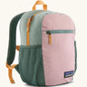 Patagonia 15 litre kids refugito day pack backpack in fuzzy mauve pink. Zipped main compartment with zipped front pocket and two mesh side pocket bottle holders on the sides. 