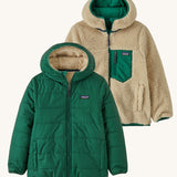 Patagonia Kids Reversible Ready Freddy Hoody in a Conifer Green showing both sides on the jacket on a plain background.