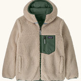 Patagonia kids reversible ready freddy hoody in canopy green shown on the fleece side with green zipped chest pocket.