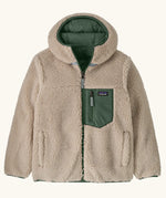Patagonia kids reversible ready freddy hoody in canopy green shown on the fleece side with green zipped chest pocket.