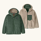 Patagonia kids reversible ready freddy hoody in canopy green shown on both sides. One side is a solid canopy green the other is cream fleeces with green zipped chest pocket.