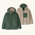 Patagonia kids reversible ready freddy hoody in canopy green shown on both sides. One side is a solid canopy green the other is cream fleeces with green zipped chest pocket.