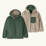Patagonia kids reversible ready freddy hoody in canopy green shown on both sides. One side is a solid canopy green the other is cream fleeces with green zipped chest pocket.