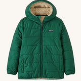 Patagonia Kids Reversible Ready Freddy Hoody in a Conifer Green showing the water resistant fleece side on the jacket on a plain background.