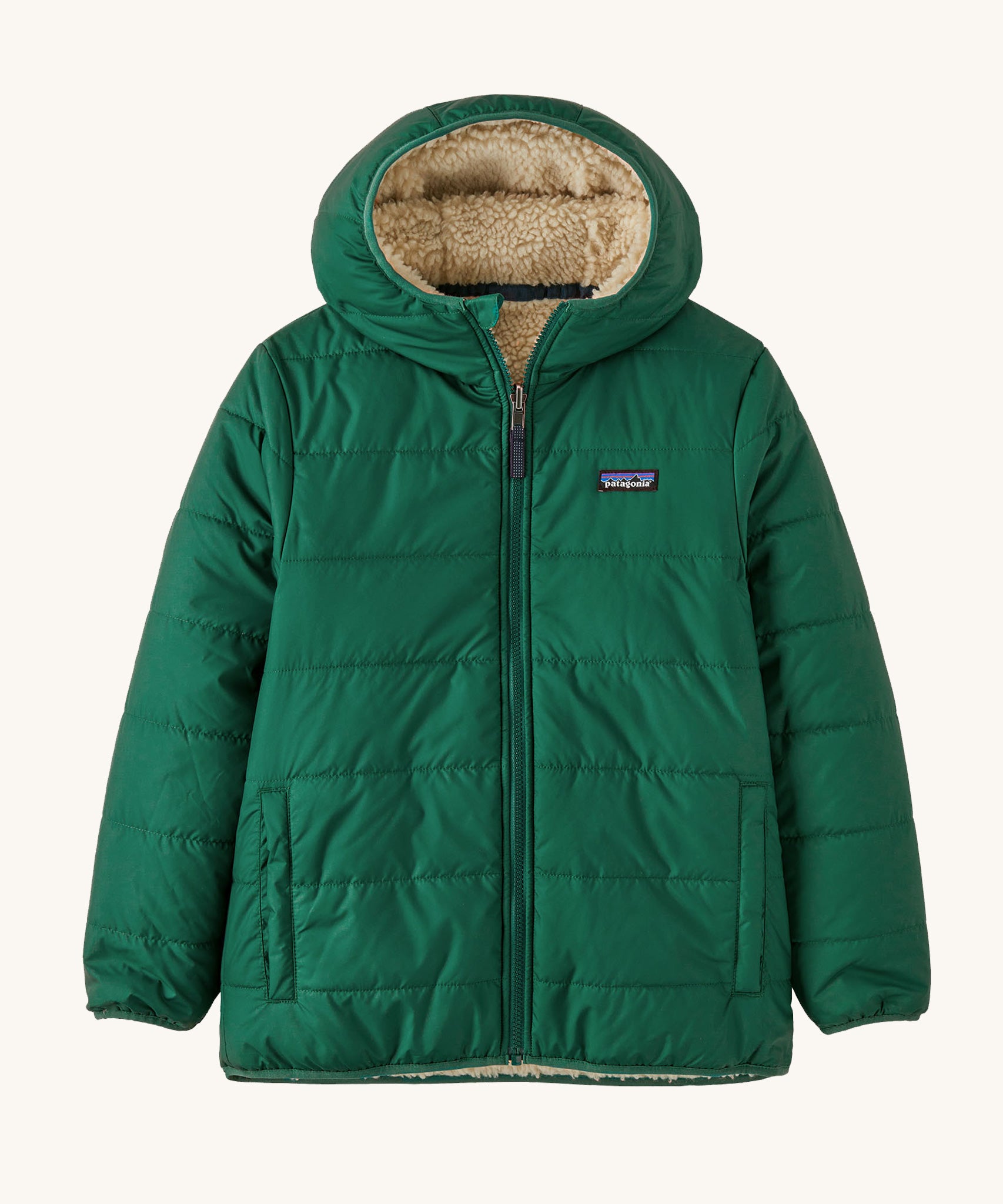 Patagonia Kids Reversible Ready Freddy Hoody in a Conifer Green showing the water resistant fleece side on the jacket on a plain background.
