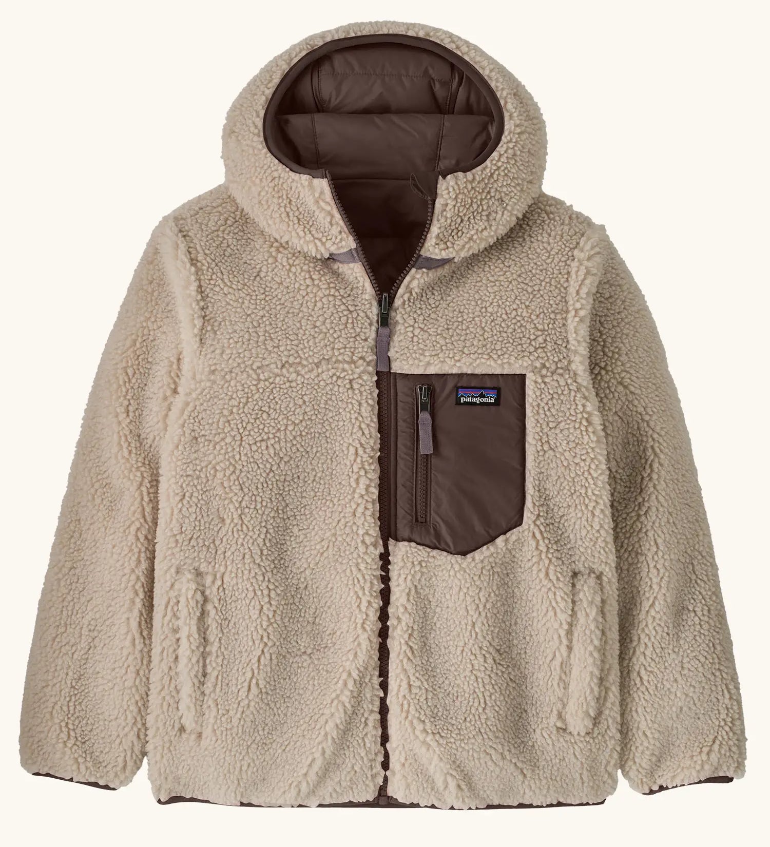 Patagonia kids reversible ready freddy hoody in den brown shown on teh fellece side. Brown zipped chest pocket with small black logo tag.