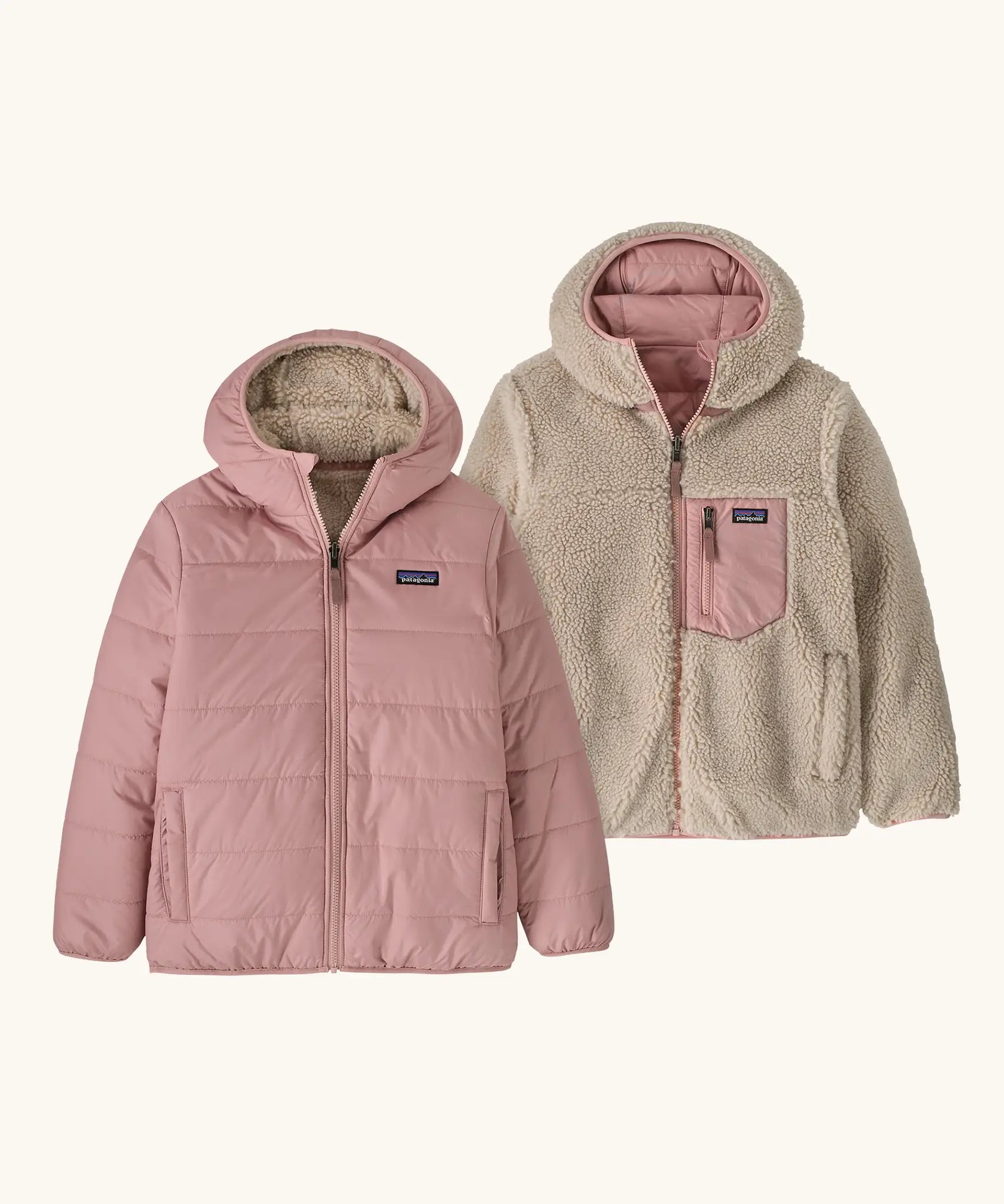 Patagonia kids reversible ready freddy hoody water resistant jacket in fuzzy mauve. Shown on both sides, pink fuzz mauve and cream fleece side with pink zipped chest pocket.