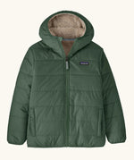 Patagonia kids reversible ready freddy hoody in canopy green on the green side with two side pockets.