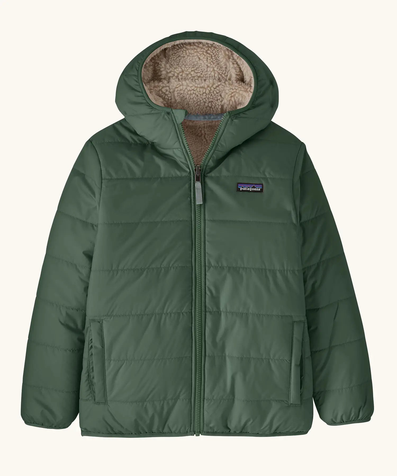 Patagonia kids reversible ready freddy hoody in canopy green on the green side with two side pockets.