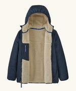 Patagonia kids reversible ready freddy hoody water resistant jacket in new navy. Front open showing cream fleece inside and navy zipped pocket.