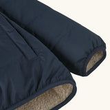 Close up of Patagonia kids reversible ready freddy hoody water resistant jacket in new navy sleeve.