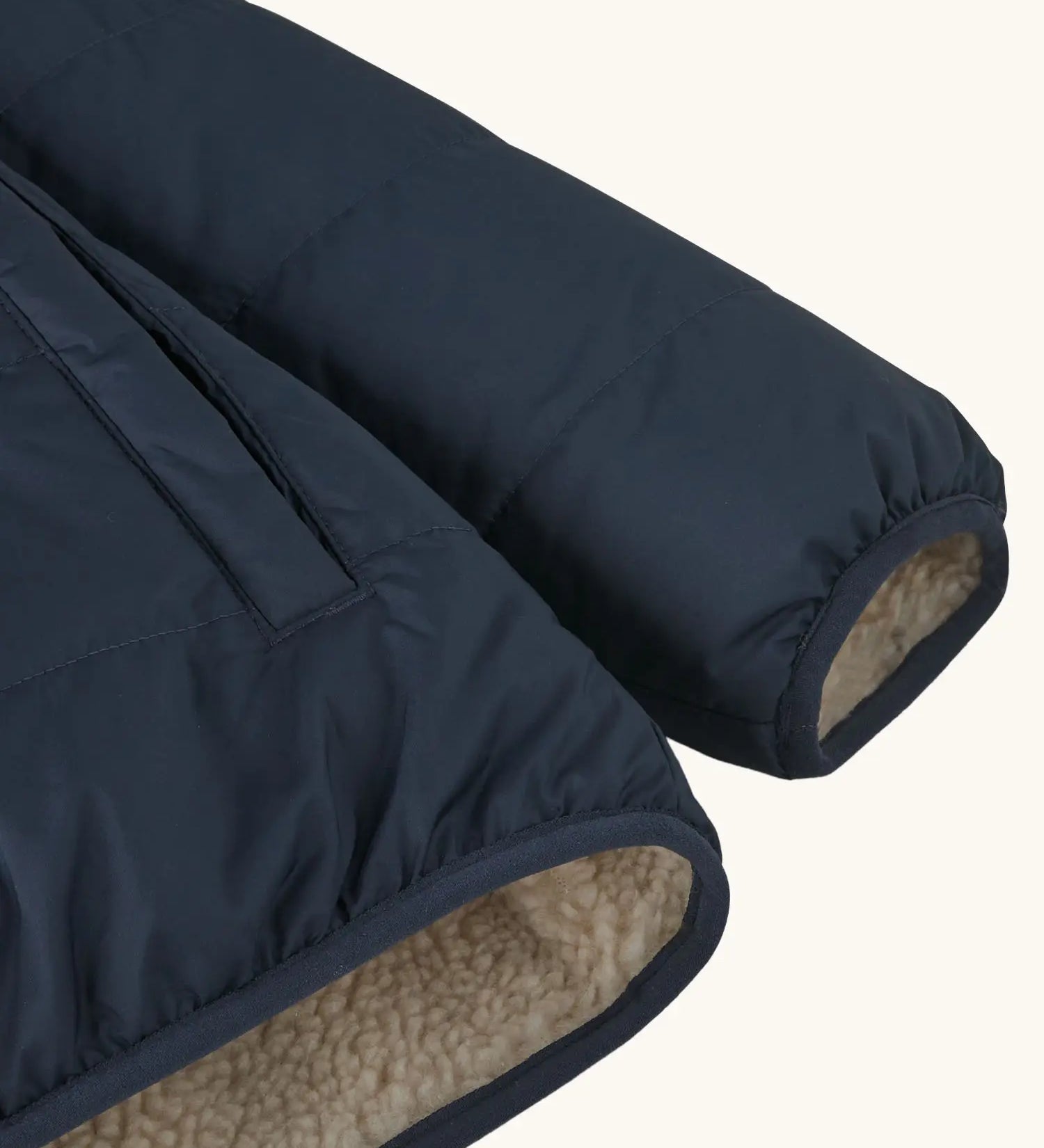 Close up of Patagonia kids reversible ready freddy hoody water resistant jacket in new navy sleeve.