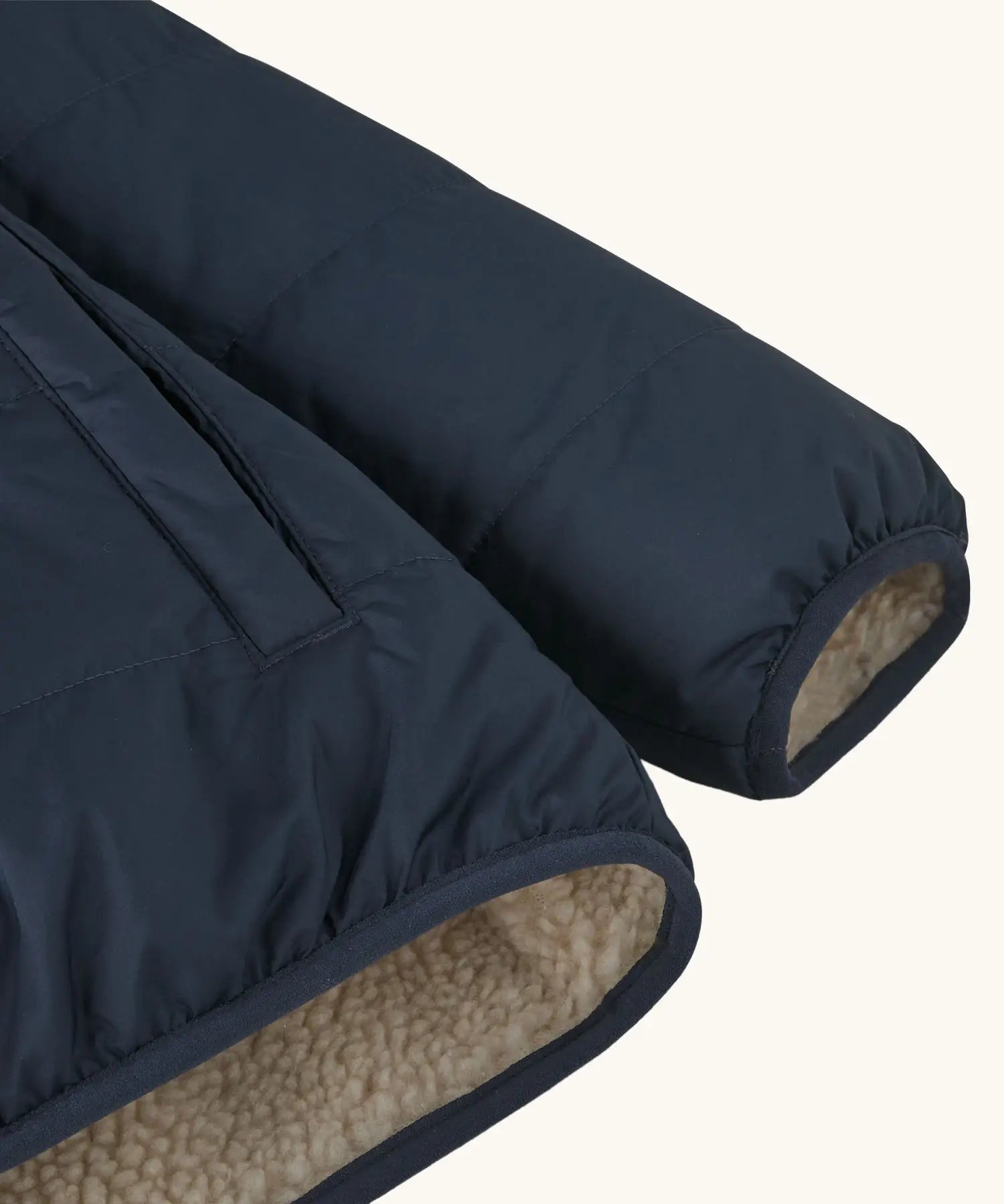 Close up of Patagonia kids reversible ready freddy hoody water resistant jacket in new navy sleeve.