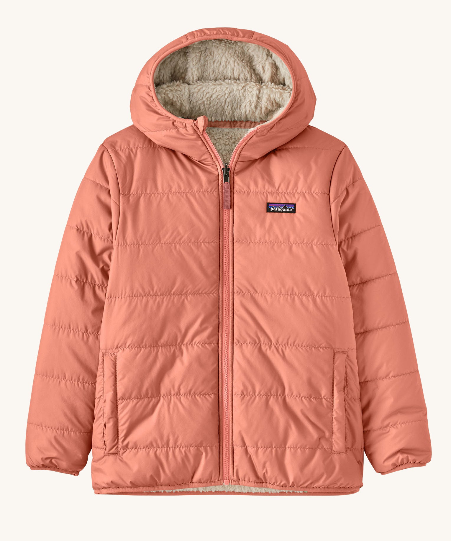 Patagonia Kids Reversible Ready Freddy Hoody in the Moment Pink colour way. The kids coat is shown with the pink water resistant shell on the outside.  We're proud stockists of Patagonia here at Babipur.