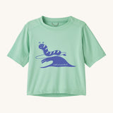Patagonia kids light green short sleeve t-short caterpillar design on a cream background.