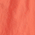 A close up of water droplets on the  surface of the material of a pair of Patagonia Kids Costa Rica Baggies Shorts.