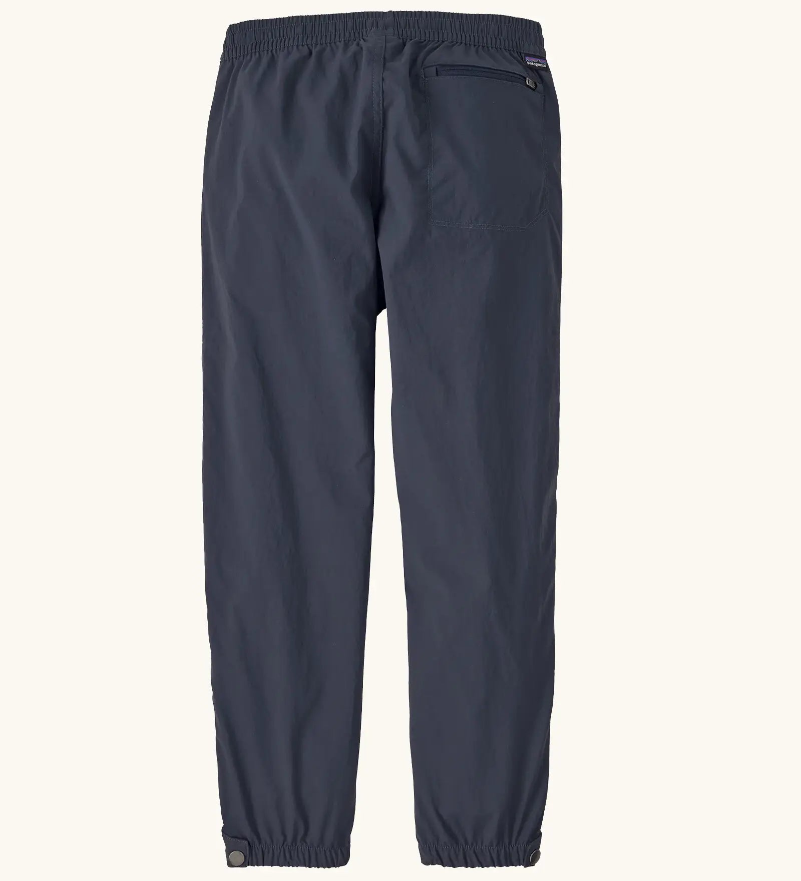 Patagonia kids waterproof quandry pants in smolder blue. with a elasticated leg cuffs and zipped back pocket
