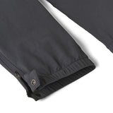 Close up of the elasticated cuff of the Patagonia kids quandry pants. Showing the popper fastener and zip detail for full leg closure.
