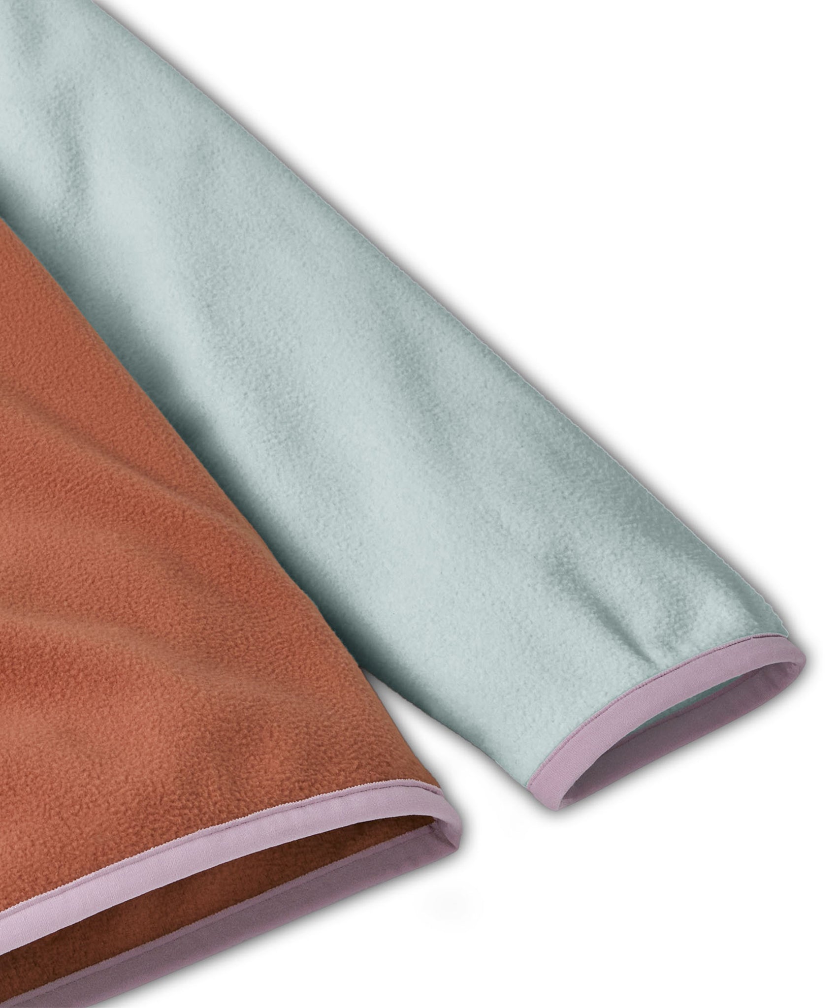 Patagonia kids fleece in Sienna clay showing close up of lilac cuff and hem trim