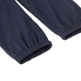 A close up of the cuffs on the legs of the Patagonia Kids Sweatpants in a Fitz Roy Icon New Navy colour way.